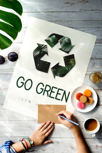 go green poster on wooden table